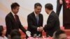 资料照：中国国家主席习近平与香港前特首梁振英握手。（2017年6月30日）